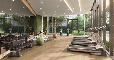 Modern home gym with exercise equipment and large windows