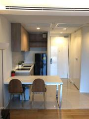 Modern kitchen with dining area and fitted appliances