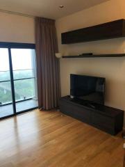 Modern living room interior with large windows and entertainment unit