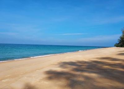 Serene beachfront view with clear blue skies