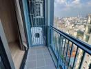 Compact balcony with city view and floor-to-ceiling window