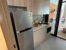 Modern kitchen with stainless steel refrigerator and ample counter space