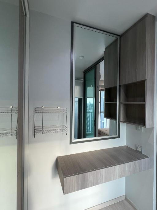 Modern bathroom with sleek design, including a vanity and a large mirror