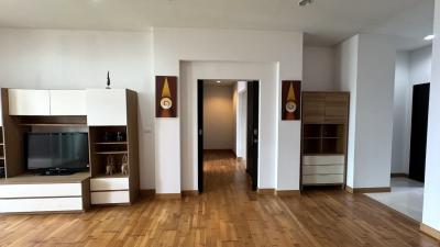 Spacious living room with hardwood floors and modern furniture