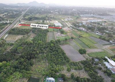 Aerial view of expansive land available for development near infrastructure