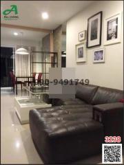 Elegant living room interior with dining area in the background