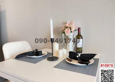 Elegantly set table in a modern dining area with decorative elements