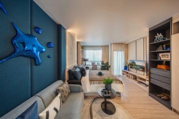 Elegant living room with contemporary design and vibrant blue wall accents