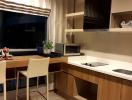 Modern kitchen with dining area and city view at dusk