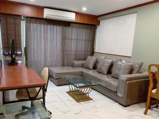 Spacious Living Room with Modern Furniture and Air Conditioning