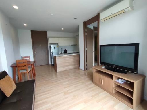 Spacious modern living room with adjacent kitchen