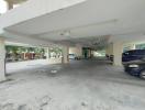 Spacious covered parking area in a residential building