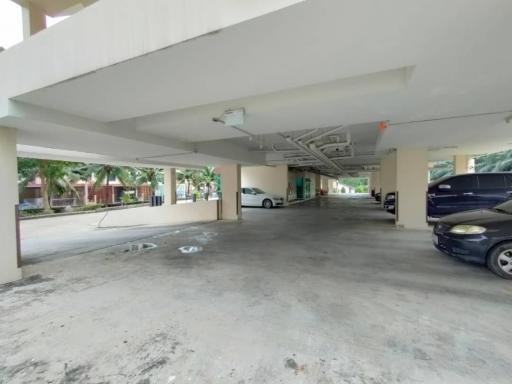 Spacious covered parking area in a residential building