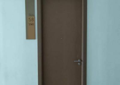 Apartment entrance door with number plate
