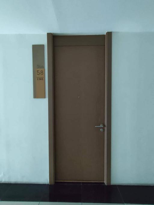 Apartment entrance door with number plate