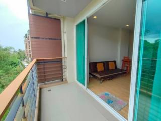 Spacious balcony with outdoor seating and a view