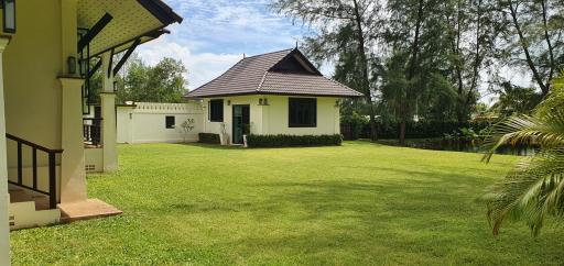 Detached house with spacious lawn and clear skies