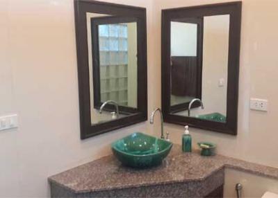 Modern bathroom with a double vanity and vessel sinks