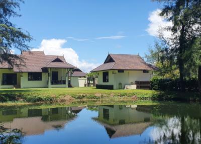 Serene lakeside homes with lush green surroundings