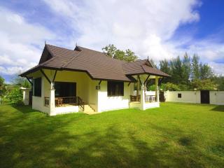 Spacious single-family home with large garden and clear sky