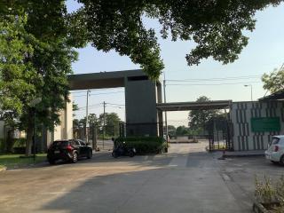 Guarded entrance of a residential complex with parking space