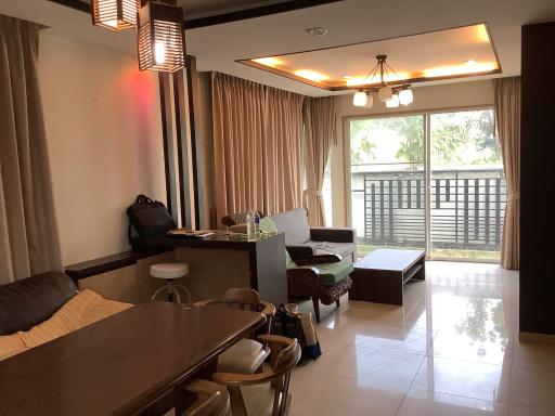 Spacious living room with dining area and natural light