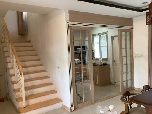 Interior of a home showing staircase and dining area