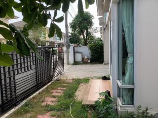 Exterior view of a house with driveway and fence