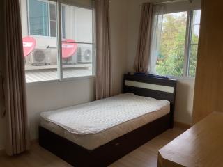 Cozy bedroom with garden view and air conditioning