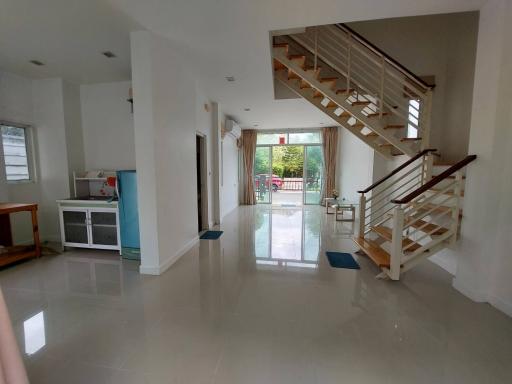 Spacious living room with staircase and modern design