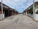 Paved street with rows of houses in a residential neighborhood