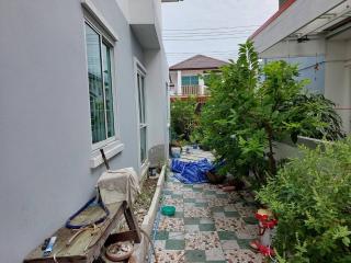 Residential home side yard with garden space