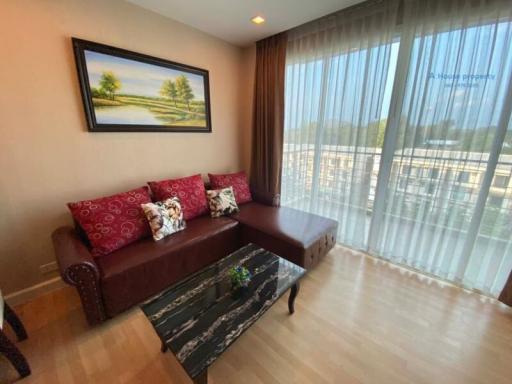 Cozy living room with sofa and large window