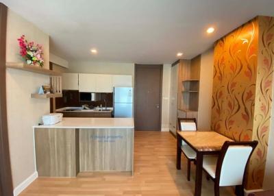 Modern kitchen and dining area with warm lighting