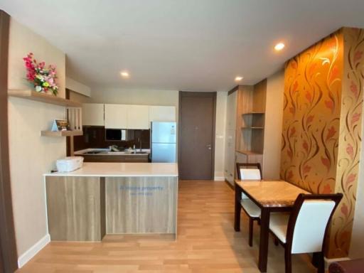 Modern kitchen and dining area with warm lighting