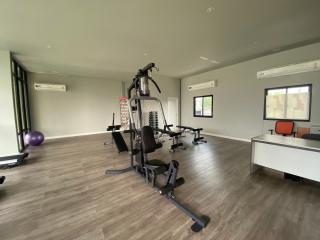 Home gym with exercise equipment and ample space