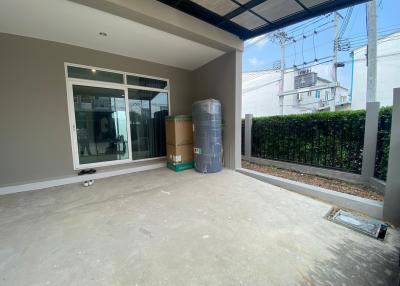 Spacious patio area with sliding doors leading into the home