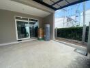 Spacious patio area with sliding doors leading into the home