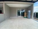 Spacious carport with concrete flooring and covered roof