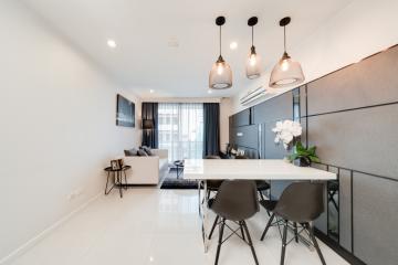 Modern and well-lit living room with dining area