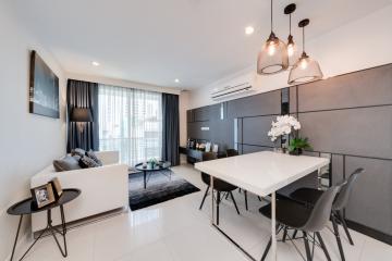 Modern and sleek living room with dining area in an apartment