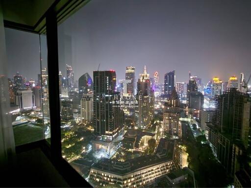 Luxurious city view from high-rise building window at night