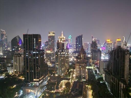 Night View of Urban Skyline with Illuminated Buildings