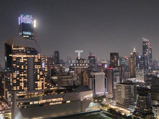 Stunning night view of a bustling cityscape with illuminated buildings