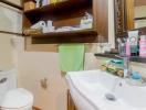 Well-organized bathroom with open shelving and essential amenities