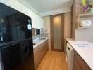 Modern kitchen interior with appliances and wood cabinetry