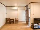 Spacious living room with wooden flooring and glass doors