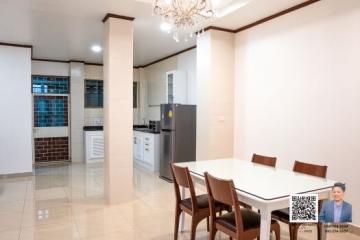 Spacious kitchen with dining area and modern appliances