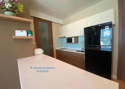 Modern kitchen with wooden cabinets and built-in appliances