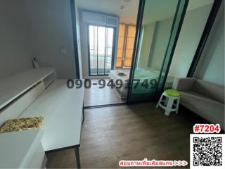 Spacious bedroom with large window and direct access to balcony